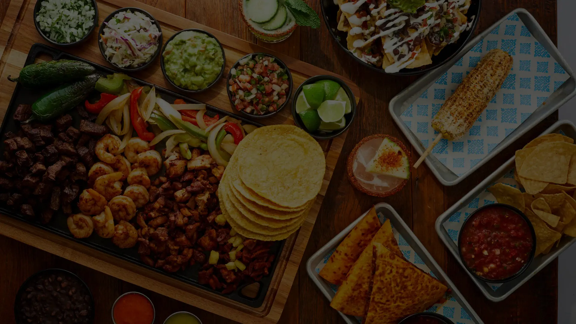 Rreal Tacos overhead spread — tacos, lime and fresh orange juice
